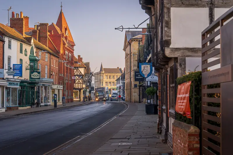 A street of old shops and timber-framed buildings in Stratford-upon-Avon