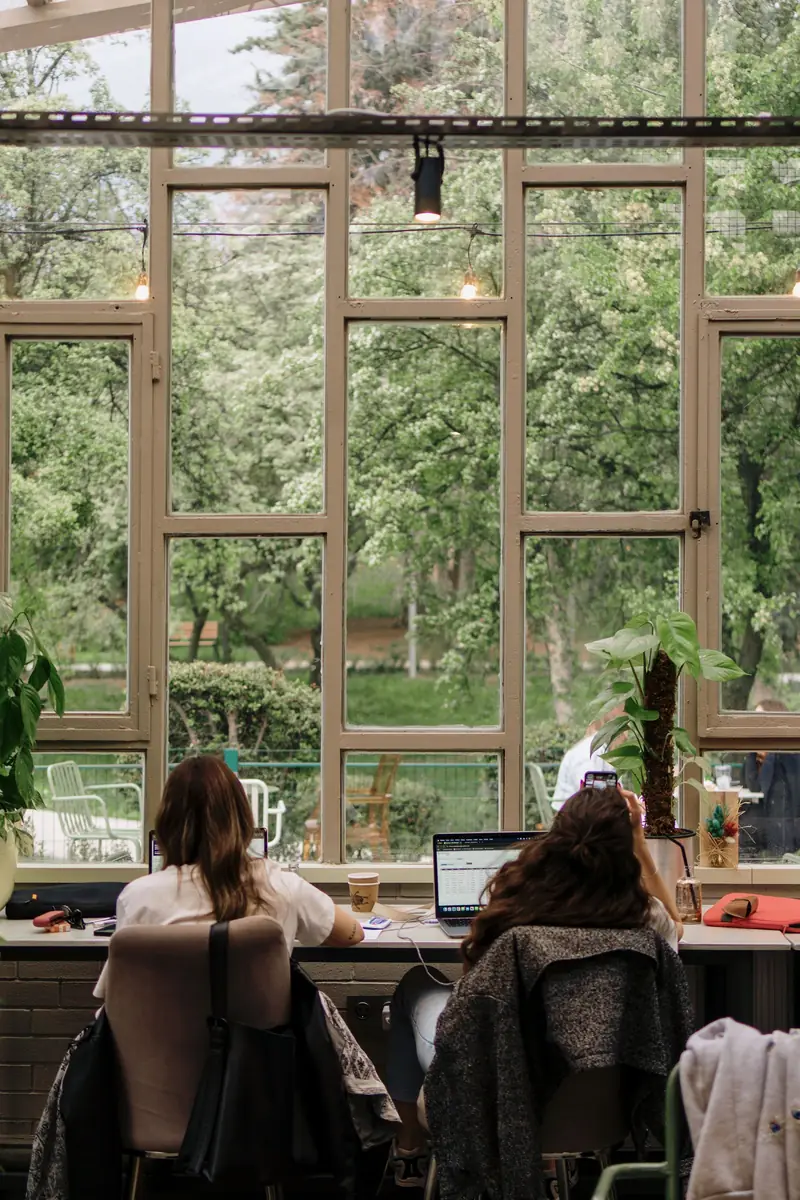 A desk with a garden view