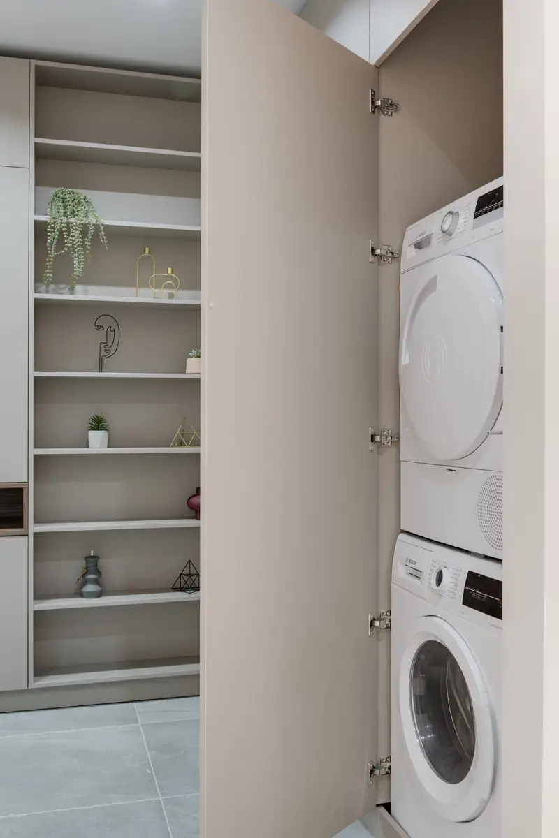 Washer behind cupboard doors