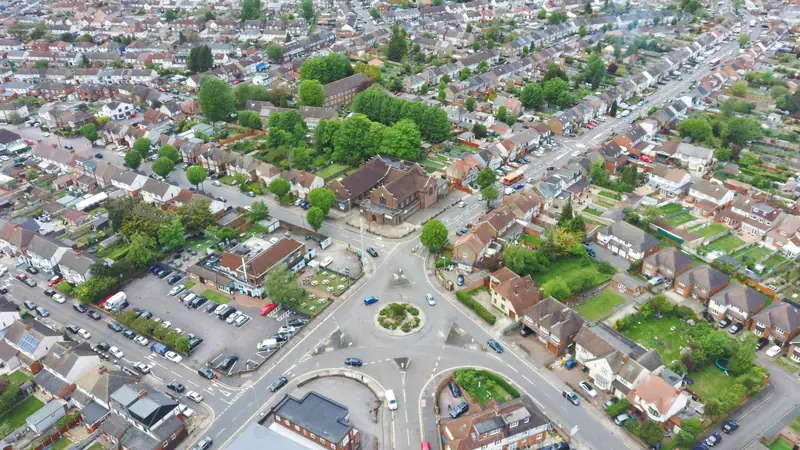 An aerial view of suburban streets around a roundabout